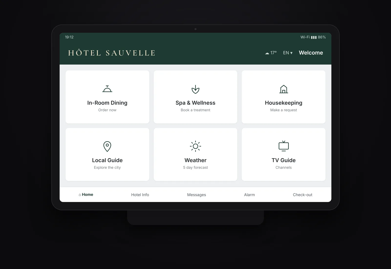 An illustrative off the shelf in-room tablet for a fictional hotel, Hôtel Sauvelle: a stock tablet in a dock showing the hotel's logo above a grid of service tiles for in-room dining, spa, housekeeping, local guide, weather and TV guide.
